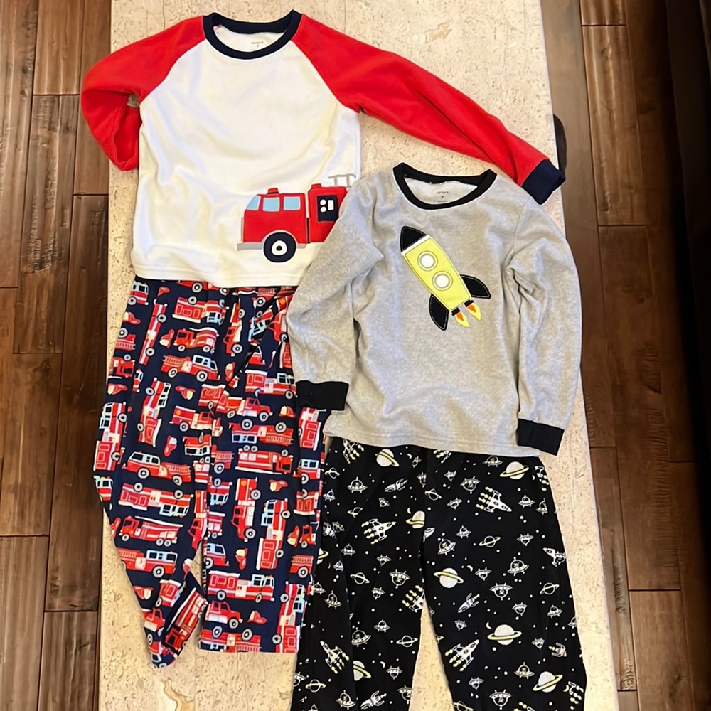 Two pair of top and bottom carter fleece pajamas size 7